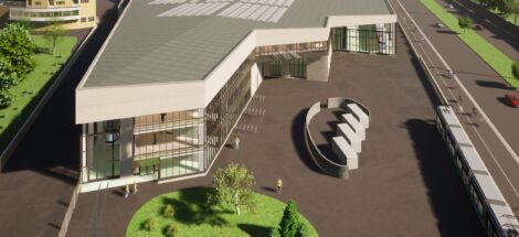 Havainnekuva Koskelan varikosta, viheralueiden keskellä suuri rakennus ja raitiotie.