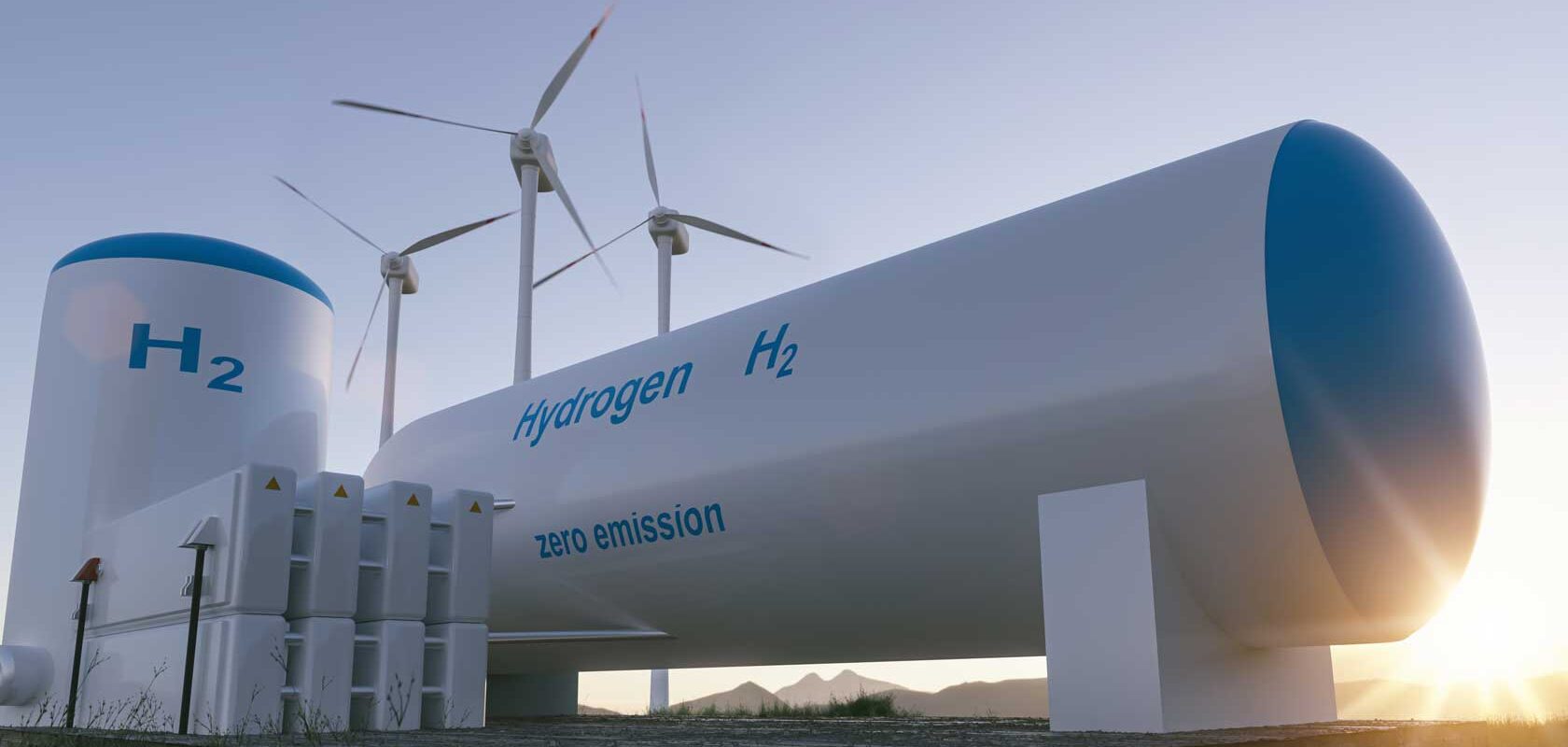 Hydrogen storage tanks in front and wind mills behind, early sunrise