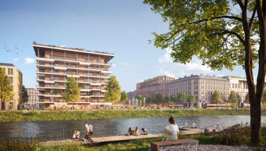 Rauhallinen jokirantanäkymä, jossa ihmiset rentoutuvat veden äärellä.