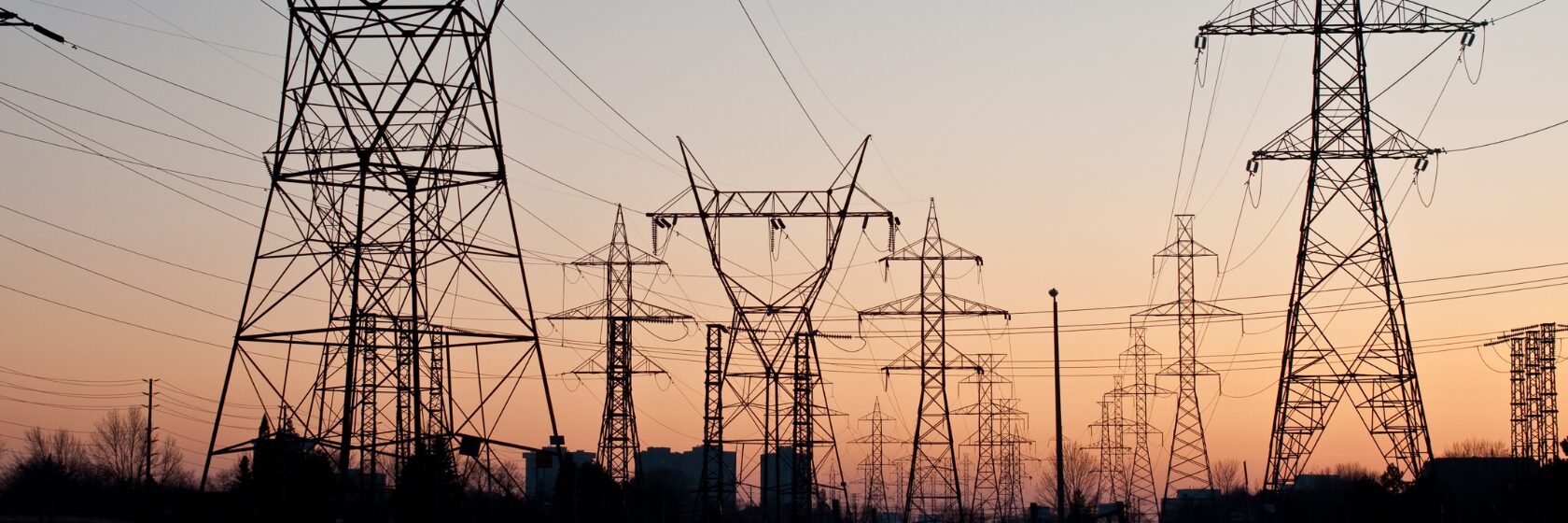 High-voltage power line park at sunset.
