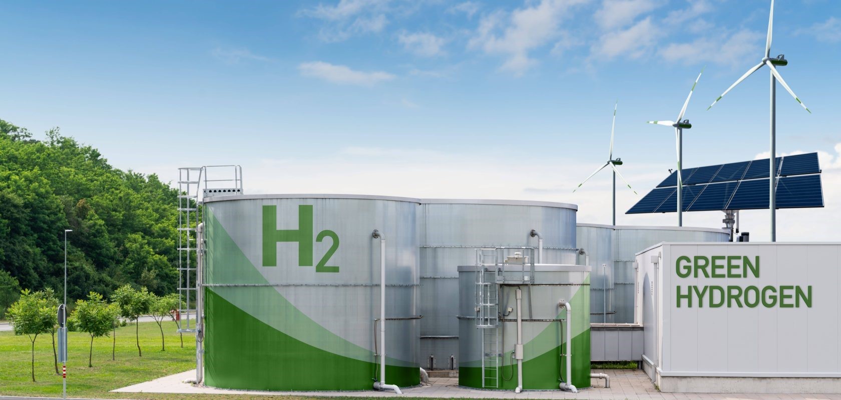 Hydrogen containers, few wind mills behind, a solar panel, sunny sky.